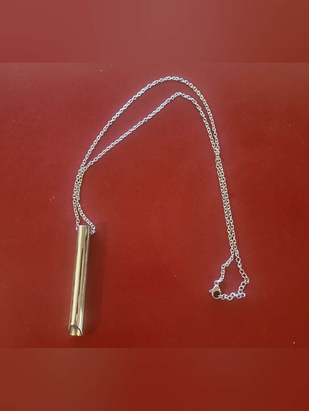 Cylindrical silver tone Cylinder Pendant Necklace calming device